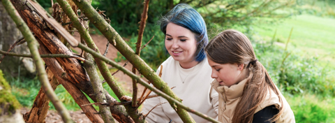 Jess and foster child building a den