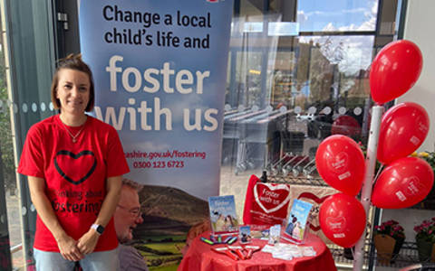 Image from one of our fostering stands featuring one carer